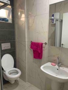 a bathroom with a toilet and a sink at Lux apartment in Cafeler caddesi in Antalya