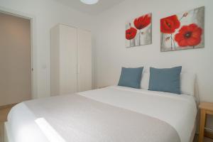 A bed or beds in a room at Sabbia Suites Casa Nina Még 1 kép