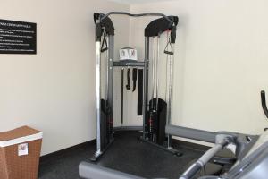 a gym with several treadmills and a treadmill at Super 8 by Wyndham Morganton in Morganton