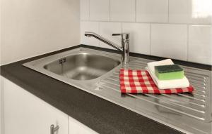 a kitchen sink with two towels and a faucet at Lovely Apartment In Oostende With Wifi in Ostend