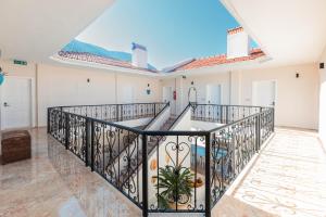 a large balcony with a wrought iron railing at Bronze Hotel in Oludeniz
