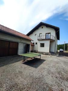 a ping pong table in front of a house at House Bosko Best place for everyone 