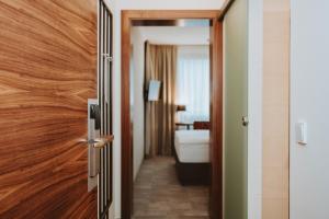 Posteľ alebo postele v izbe v ubytovaní Hotel Brücklwirt