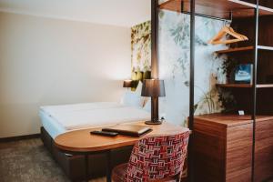 Posteľ alebo postele v izbe v ubytovaní Hotel Brücklwirt