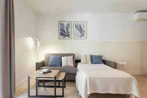 Posteľ alebo postele v izbe v ubytovaní Apartments Sata Olimpic Village Area
