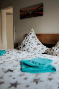 a bedroom with a bed with stars on it at Welcome Haus Allgäu in Memmingen