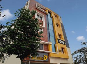 a building with a sign on the side of it at Global Stay Near Kengeri Bus Terminal Metro Station in Bangalore