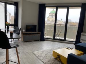 a living room with a view of a building at Apartment Opalchenska / Pirotska in Sofia