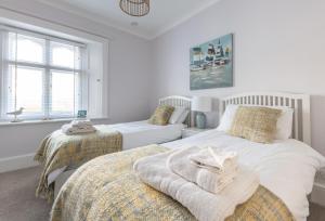 Voodi või voodid majutusasutuse Landward Cottage Isle of Wight toas +6 fotot