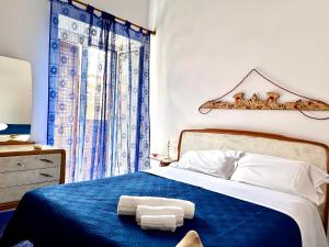 A bed or beds in a room at L'Antico Palazzo