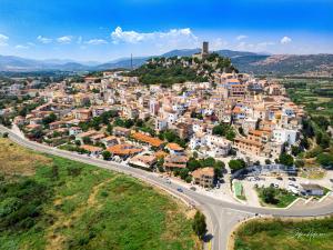 an aerial view of a town on a hill at Maria Caderina House in Posada