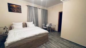 Ένα ή περισσότερα κρεβάτια σε δωμάτιο στο Altunyan Hotel
