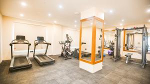 a gym with treadmills and elliptical machines at Leroy Grand - Yeshwanthpur in Bengaluru