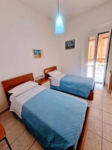 A bed or beds in a room at Puzzle al Mare