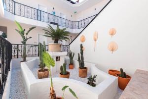 a staircase with plants in a house at Bronze Hotel in Oludeniz