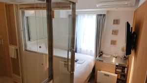 TV a/nebo společenská místnost v ubytování EN Hotel Shibuya