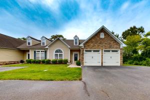 a house with two garage doors on a driveway at Creekside --- 57 Tributary Lane in Millville