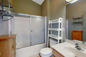 a bathroom with a shower and a toilet and a sink at Bethany Beach Inn - 39634 Jefferson Bridge Rd #201 in Bethany Beach +5 photos