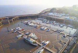 an aerial view of a marina with boats in the water at Toll House in Nether Stowey