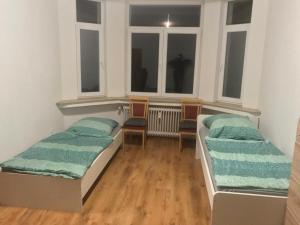 Giường trong phòng chung tại K&K Unterkunft GbR, Wohunung 3