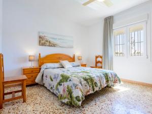 a bedroom with a bed and a dresser and a window at Villa Villa Lolin by Interhome in Vinaròs