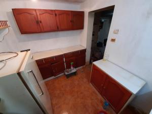 an overhead view of a kitchen with wooden cabinets at Welcome to Snad in Băile Tuşnad