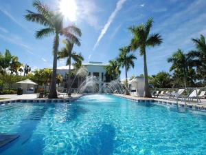 a swimming pool with a fountain and palm trees at Apartment Provident Doral at The Blue-7 by Interhome in Miami