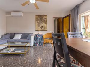 a living room with a couch and a table at Apartment Riumar by Interhome in Segur de Calafell