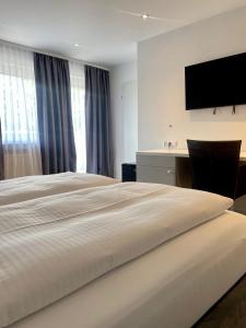 Postel nebo postele na pokoji v ubytování Hotel Wittlicher Hof