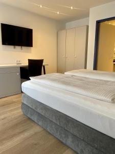 Postel nebo postele na pokoji v ubytování Hotel Wittlicher Hof