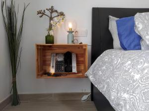 A bed or beds in a room at Aqua Apt Sunrise & Sea Views