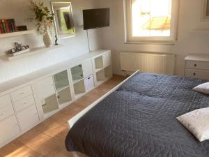 Postel nebo postele na pokoji v ubytování Gästezimmer zum Waldsachsener Grund