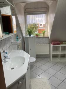 Koupelna v ubytování Gästezimmer zum Waldsachsener Grund