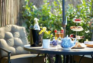 a table with food and desserts on top of it at The Cwtch in Pencoed