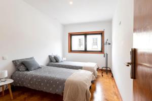 Postel nebo postele na pokoji v ubytování Casa da Granja