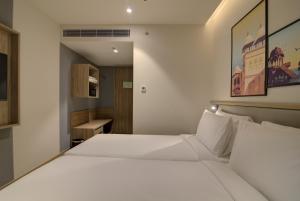 Posteľ alebo postele v izbe v ubytovaní 7 Apple Hotel Pratap Nagar, Jaipur