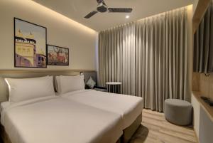 Posteľ alebo postele v izbe v ubytovaní 7 Apple Hotel Pratap Nagar, Jaipur