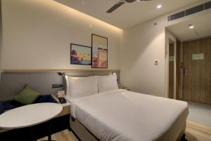 Posteľ alebo postele v izbe v ubytovaní 7 Apple Hotel Pratap Nagar, Jaipur