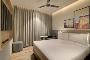 Postel nebo postele na pokoji v ubytování 7 Apple Hotel Pratap Nagar, Jaipur