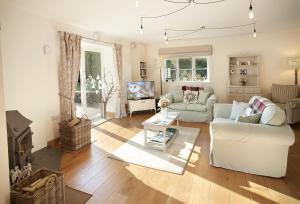 a living room with a couch and a tv at Orchard View 