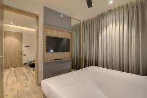 Posteľ alebo postele v izbe v ubytovaní 7 Apple Hotel Pratap Nagar, Jaipur