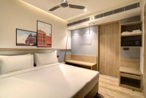 Posteľ alebo postele v izbe v ubytovaní 7 Apple Hotel Pratap Nagar, Jaipur