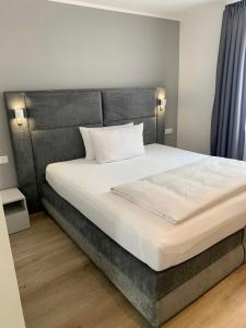Postel nebo postele na pokoji v ubytování Hotel Wittlicher Hof