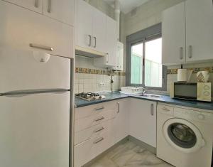 Kuchyňa alebo kuchynka v ubytovaní TRIANA EXCLUSIVE con terraza privada