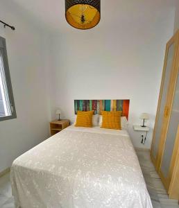 Posteľ alebo postele v izbe v ubytovaní TRIANA EXCLUSIVE con terraza privada