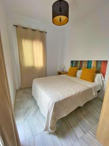 Posteľ alebo postele v izbe v ubytovaní TRIANA EXCLUSIVE con terraza privada