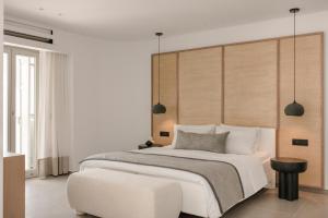 Cama ou camas em um quarto em Grace Mykonos