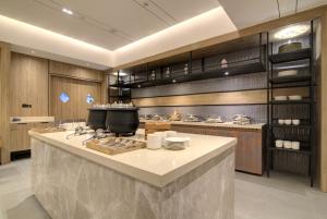 Kuchyňa alebo kuchynka v ubytovaní 7 Apple Hotel Pratap Nagar, Jaipur
