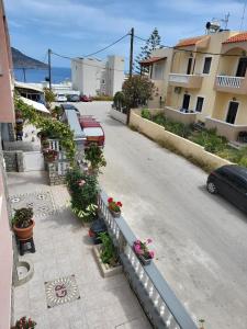 an aerial view of a street with cars and flowers at Roumeliotis house in Karpathos