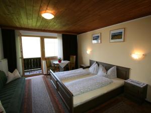 Posteľ alebo postele v izbe v ubytovaní Apartment Tom by Interhome